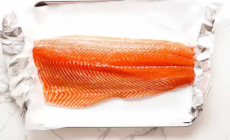 Atlantic salmon side on a white marble surface